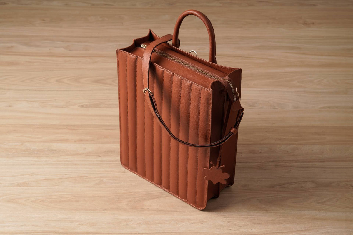 Channel-Stitched Tote Backpack in ORVA plant-based material – view 1